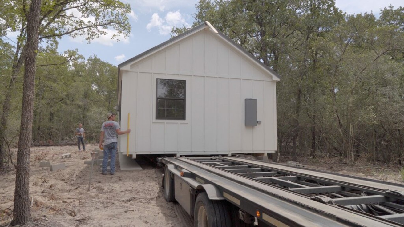 Cabin being positioned at site